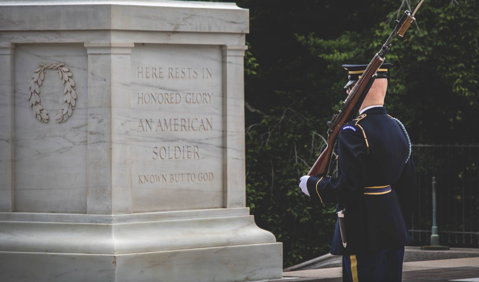 The Tomb of the Unknown Soldier at Arlington National Cemetery in Arlington County, Virginia, United States is the burial site (and the white, marble sarcophagus above it) of a World War I soldier whose remains were unidentifiable. After a design competition was held in 1928, the winning project was completed in 1932. The site now also includes the gravesites of two other unknowns, one from World War II and one from the Korean War, who were buried under two slabs between it and the Memorial Amphitheater behind it.